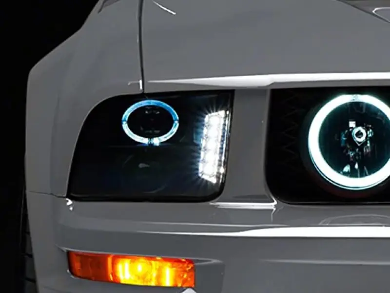 Raxiom LED Halo Projector Headlights w/ Factory Halogen Headlights, Black Housing & Smoked Lens (05-09 Mustang) (RAX49128)